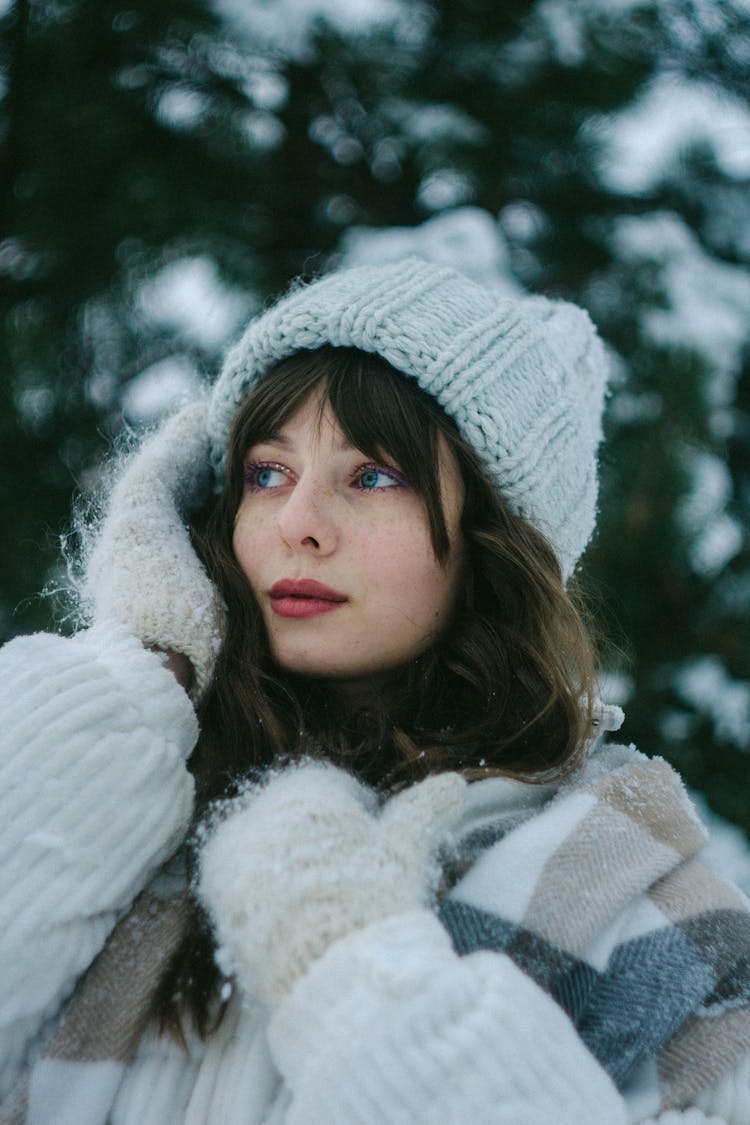 Portrait Of Woman In Winter Clothes And Mittens