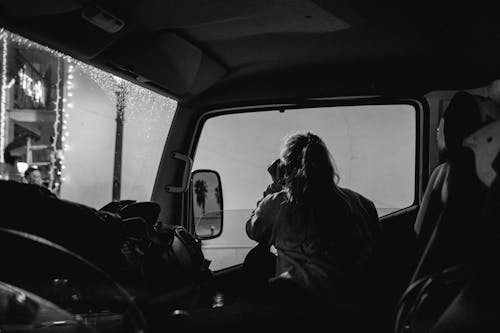 Woman Looking Outside a Car Window