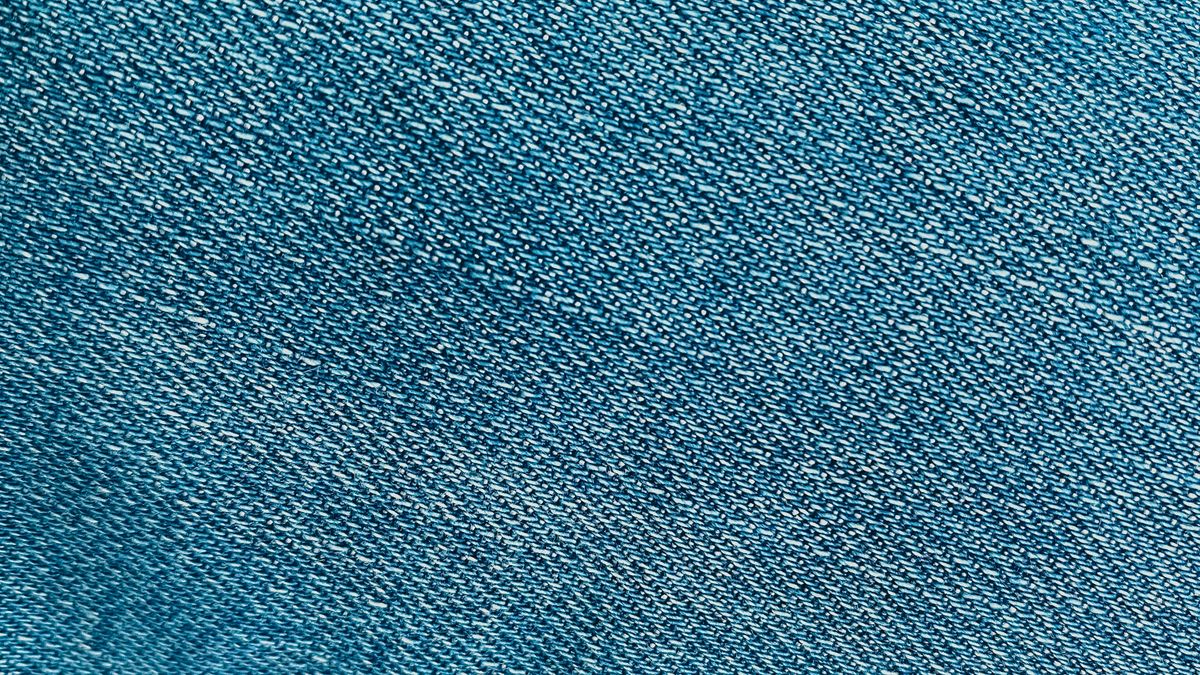 Close-up of blue denim fabric showing the weave