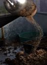Water Pouring on Blue Plastic Bucket