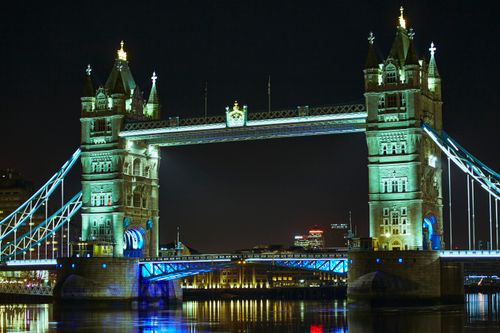 Free Illuminated Tower Bridge over the River Thames at night in London, United Kingdom. Stock Photo