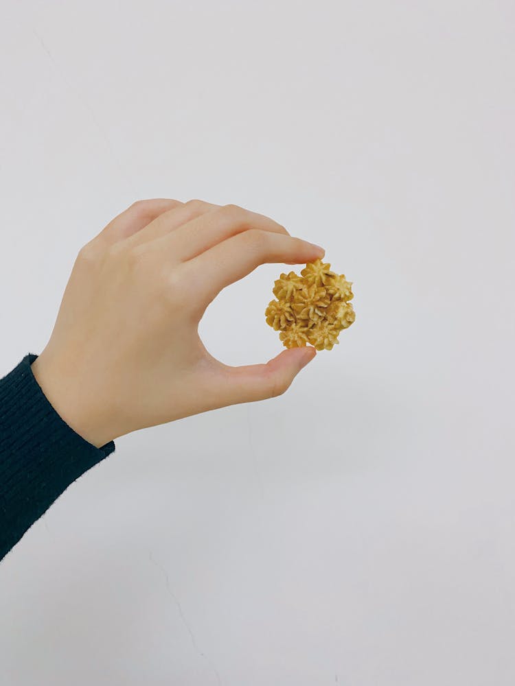 Woman Hand Holding Cookie