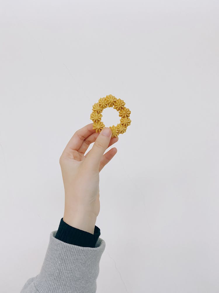 Hand Holding A Decorative Cookie