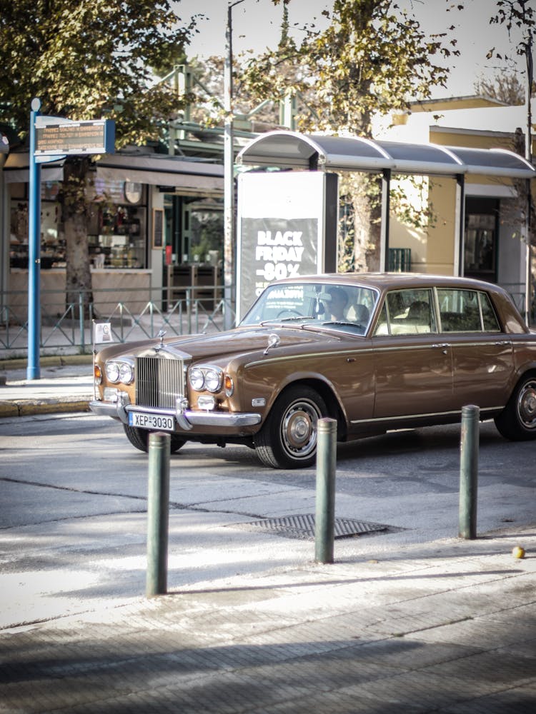 A Brown Car On The Road