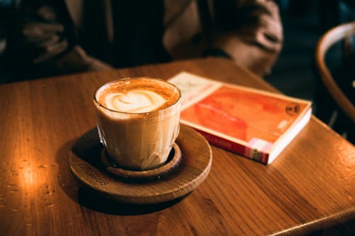 Free  Cup of Coffee on Woden Saucer Stock Photo