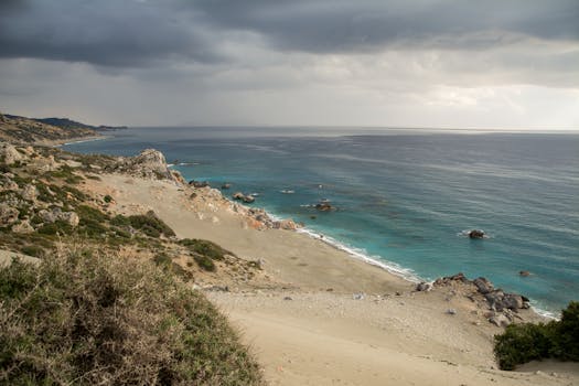 Explore a dramatic seascape with rugged coastline and cloudy skies, ideal for nature and travel themes.