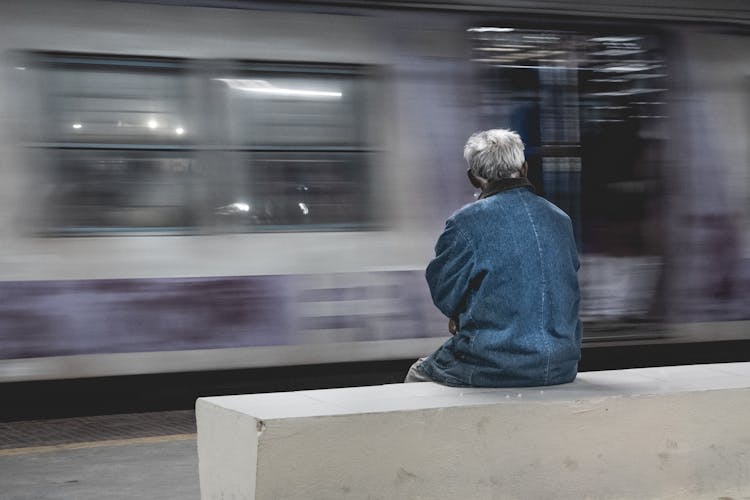 Elderly Man Looking At Train 