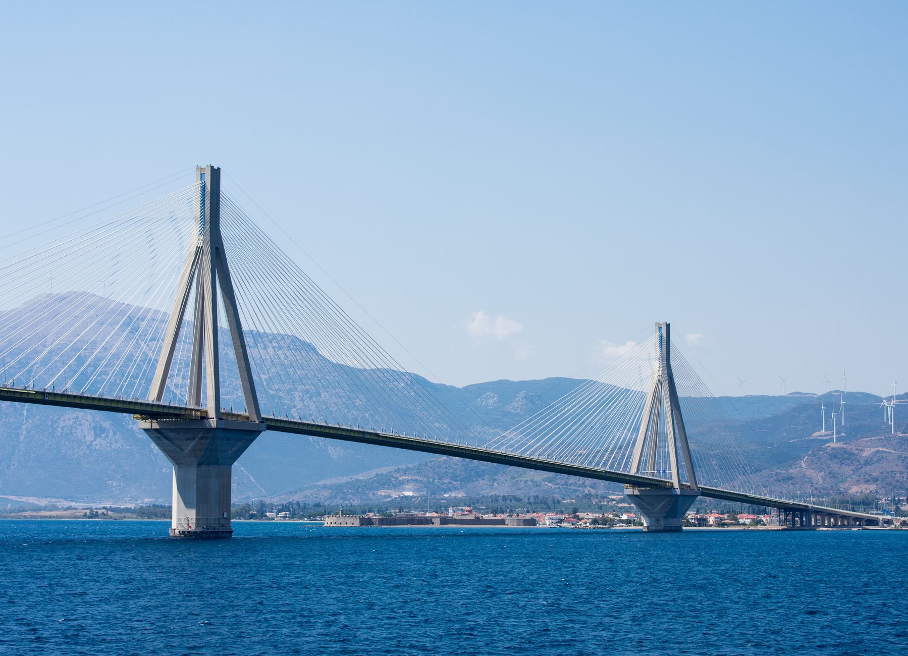 Spectacular view of the Rion-Antirion Bridge spanning the blue ocean near Patras, Greece.