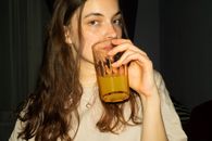 Woman Holding Clear Drinking Glass