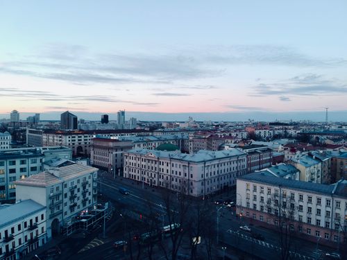 Free Scenic aerial view of Minsk cityscape during twilight, showcasing historic architecture and city skyline. Stock Photo