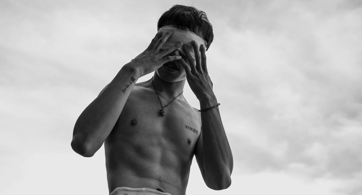 Black and White Photo of a Man Covering his Eyes · Free Stock Photo