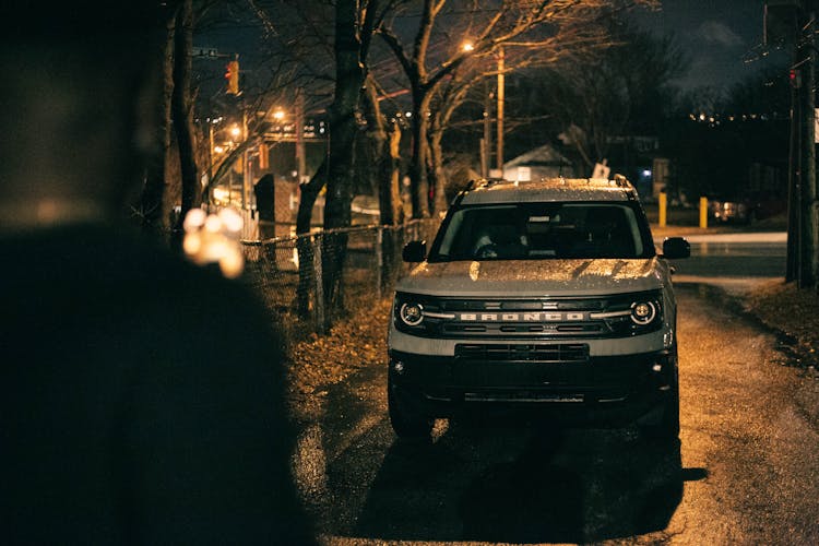 A White Ford Bronco Sport Parked At Night