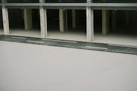 Gray Concrete Driveway Beside White Concrete Building