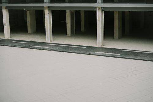 Free Minimalistic architectural view with concrete pillars and empty open space. Stock Photo