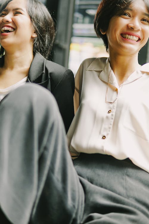 Close-Up Shot of Two Women Laughing Together