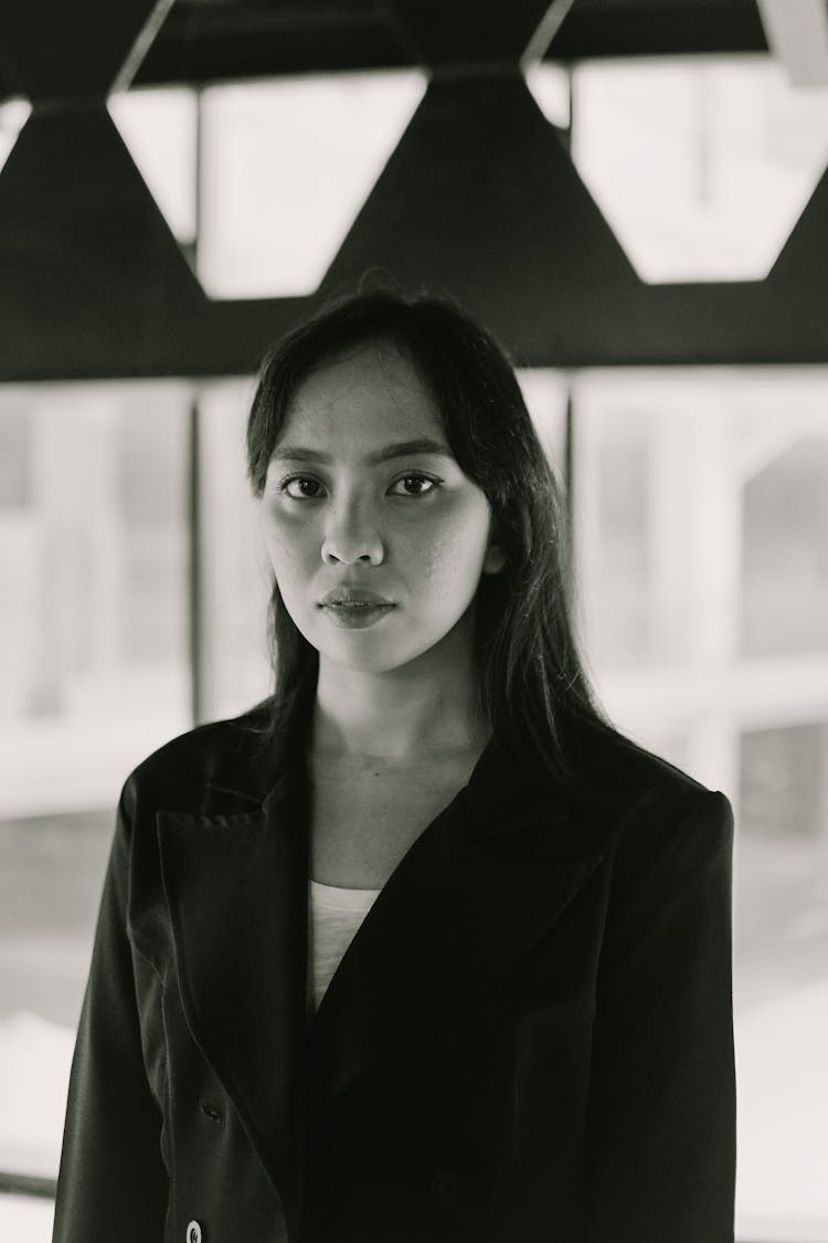 Young Woman With Black Long Hair In Building Interior