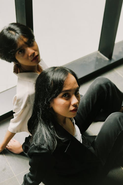 Women Sitting on the Floor