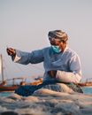 Fisherman Knitting Fish Net 