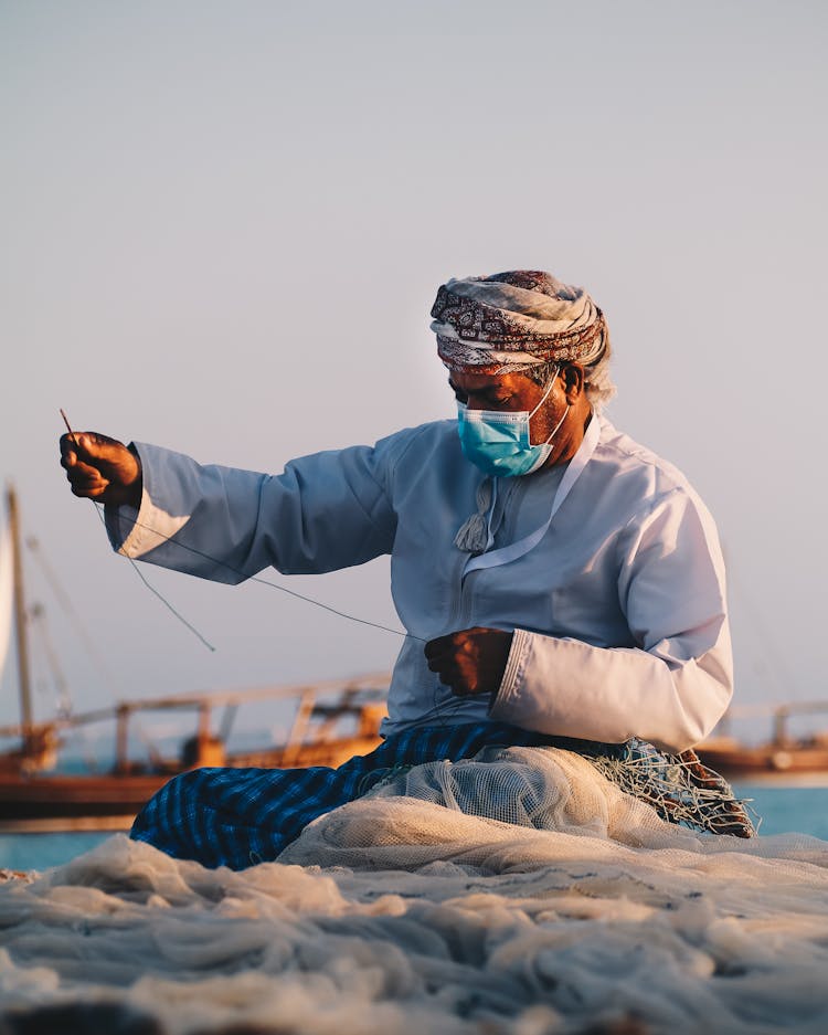 Fisherman Knitting Fish Net 