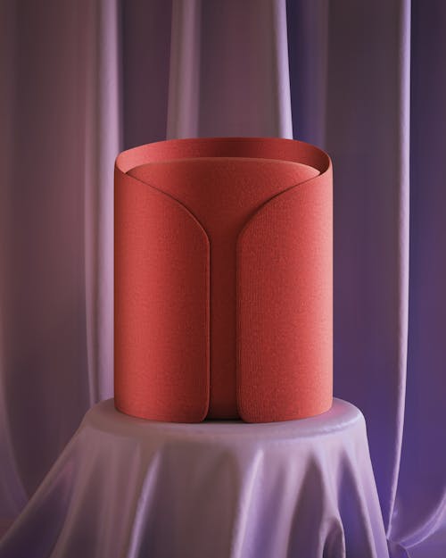Cylinder in Red Collar on Table