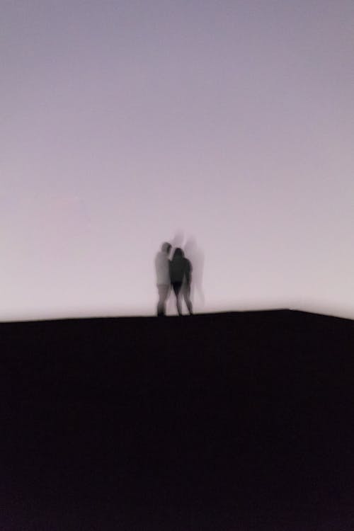 A Blurry Silhouette of a Couple