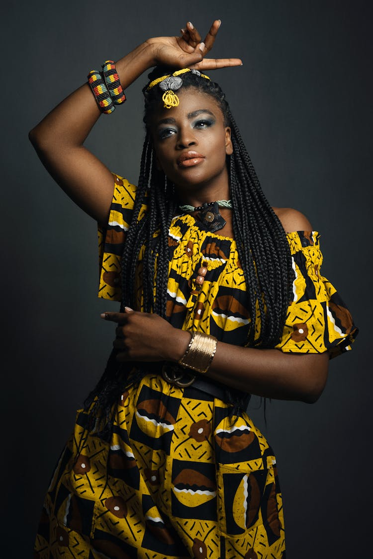 Fashion Female Model Wearing Yellow Dress With Exotic Patterns