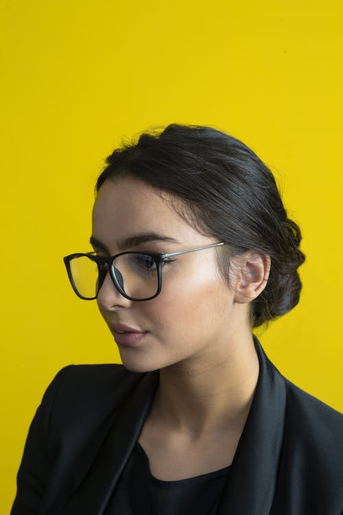 Close-Up Shot of a Woman Wearing Eye Glasses