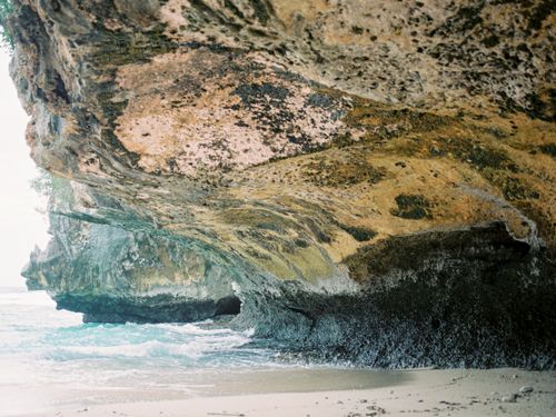 Free Coastal cliffs in Bali offering breathtaking views of natural rock formations and the sea. Stock Photo