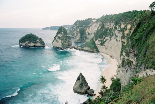 Stunning coastal view showcasing dramatic cliffs and vibrant waves at Nyang Nyang Beach, Bali.