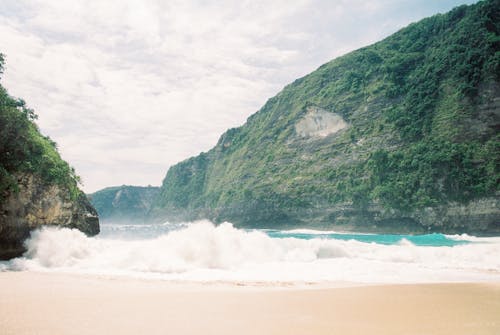 Sea Waves Crashing on the Beach Sand