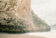 Brown Rock Formation on Beach