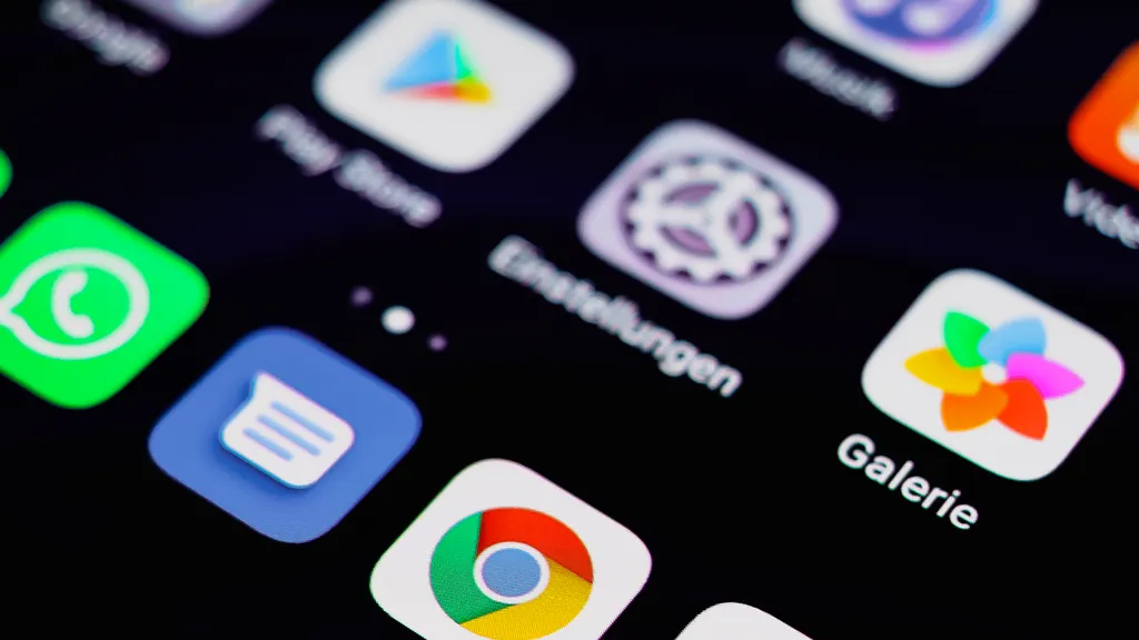 Close-up of a smartphone screen showing app icons on a dark background