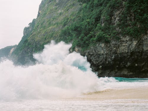 An Ocean Waves Crashing on Beach Sand