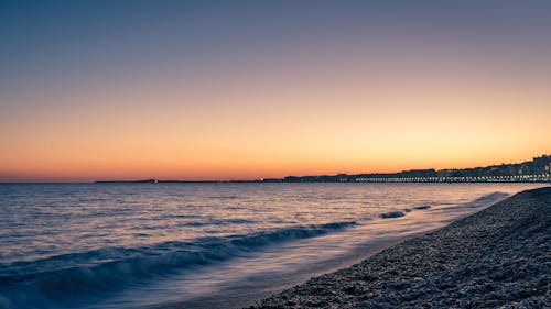 Безкоштовне стокове фото на тему «берег моря, ефектне небо, Захід сонця»