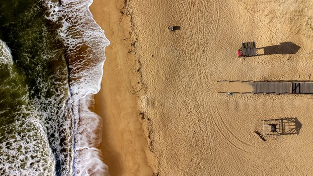 Explore the serene beauty of a secluded beach in Rio de Janeiro, captured from above.
