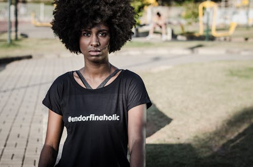 Woman Wearing Black T-shirt Standing Near Playground
