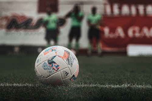 Free A Soccer Ball on the Grass of a Soccer Field Stock Photo