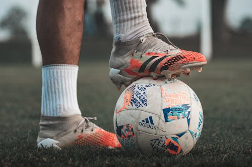 Free A Player Stepping on a Soccer Ball Stock Photo