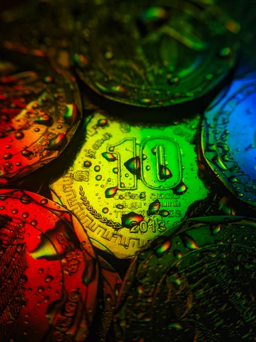 Close-Up Shot of Wet Coins