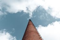 Brown Brick Building Under Blue Sky