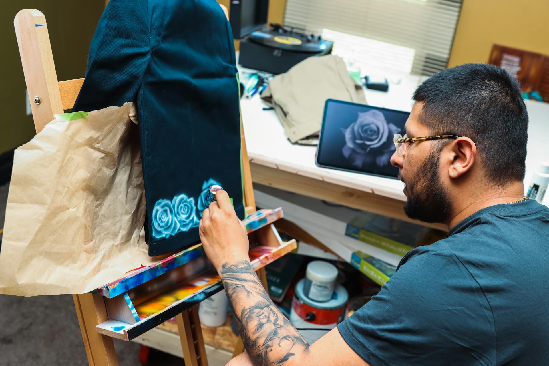 An Artist Painting on a Garment