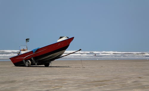 A Red Boat on the Beach