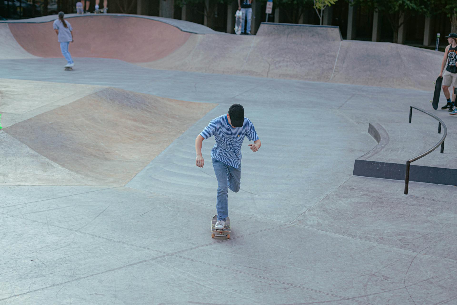 A skateboarder rides in a Minneapolis skatepark, showcasing outdoor recreation and urban sports.