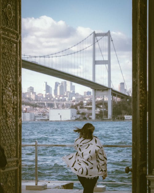 Woman Looking at Bosphorus Bridge, Istanbul, Turkey