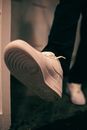 Person Wearing White Nike Athletic Shoe