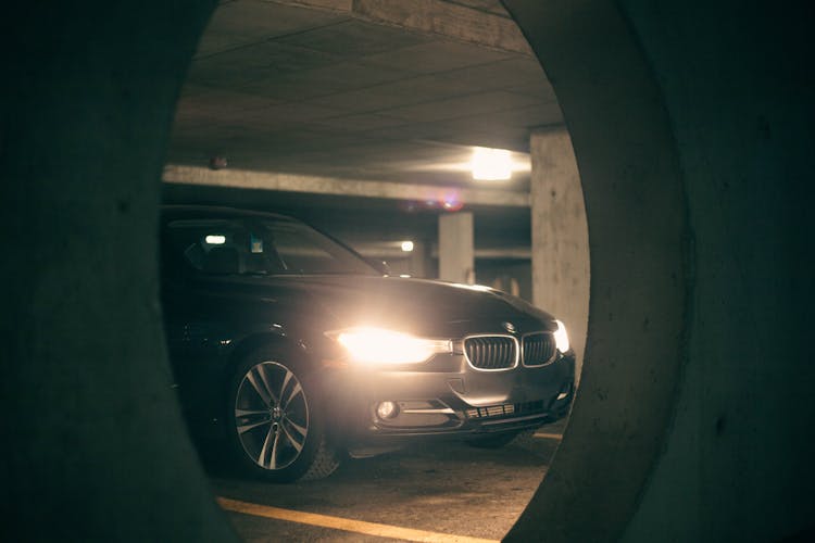 Modern Car With Lights On Underground Parking