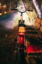 Red and Black Motor Scooter on Brown Wooden Floor