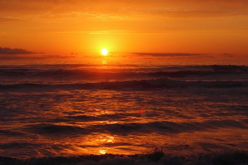 Free Stunning sunset scene capturing the vibrant hues over the ocean waves at El Tabo, Chile. Stock Photo