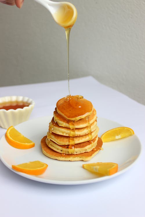 Free Drizzling Pancakes with Syrup Stock Photo