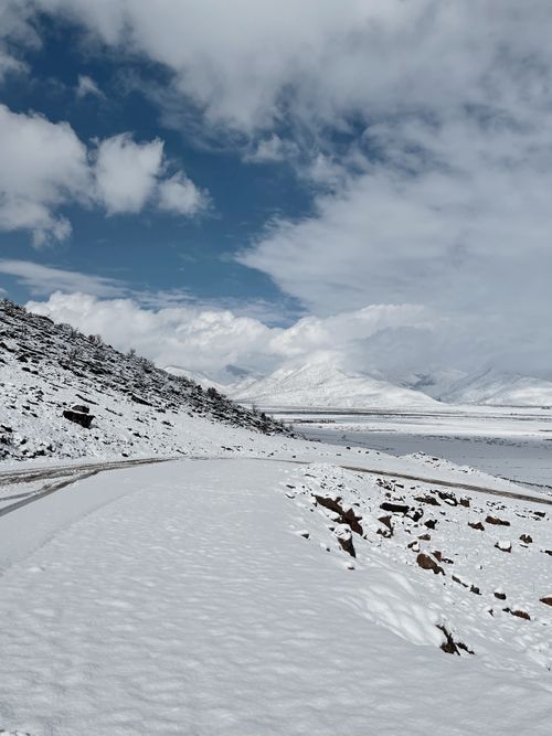 Free A serene winter landscape of snow-covered mountains in Ranya, Iraq. Stock Photo